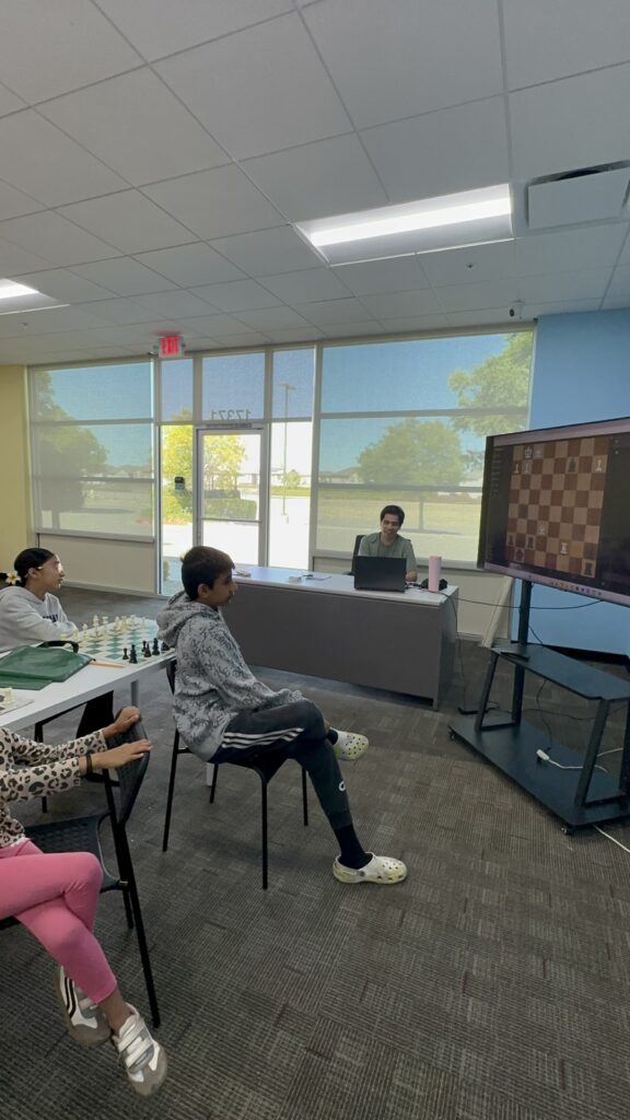 Students participating in chess camp at Y2L Academy.